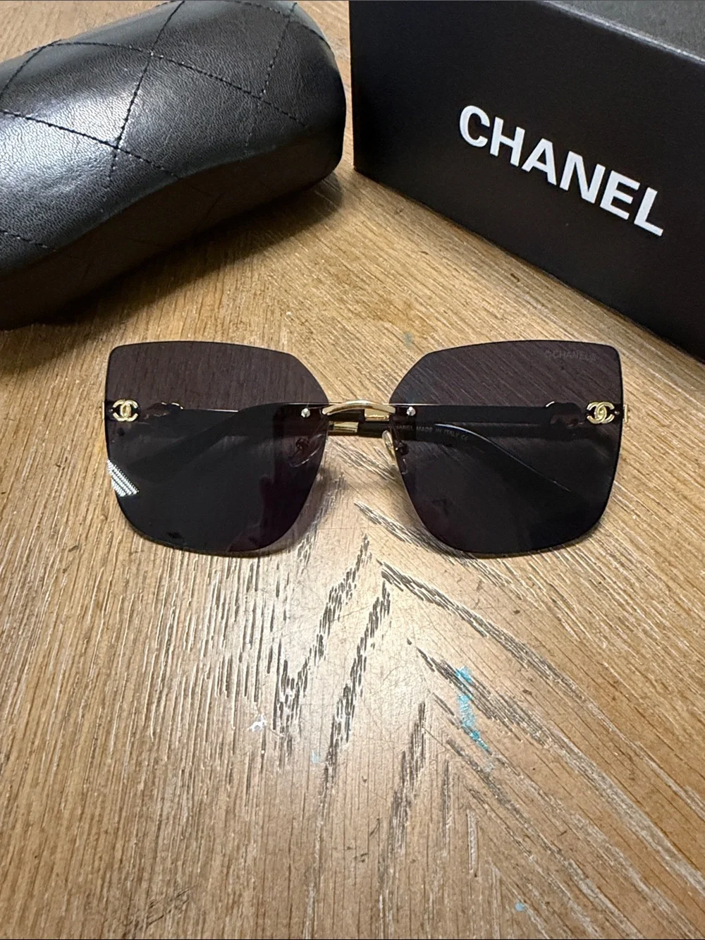CHANEL Rimless Square Sunglasses in Dark Gradient with Gold Accents